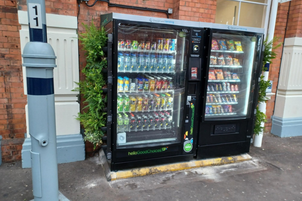 Vending machine with 'living walls' attached to sides