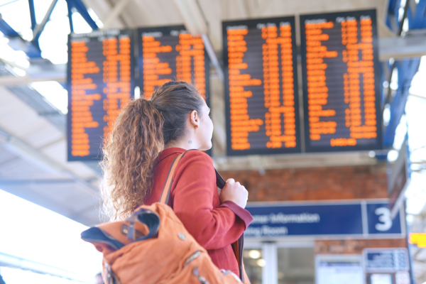 Customer looking at overhead departure boards