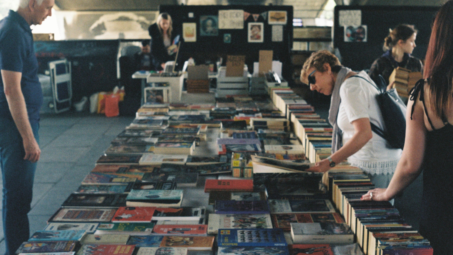 Image of people looking at books at a book market