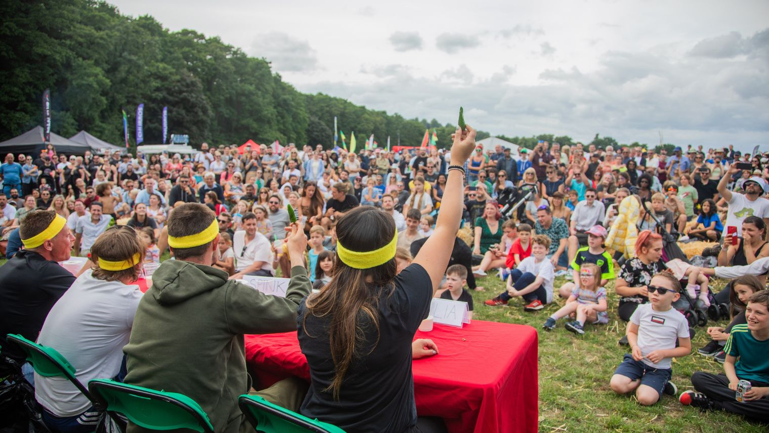 Chilli eating competition with a crowd watching