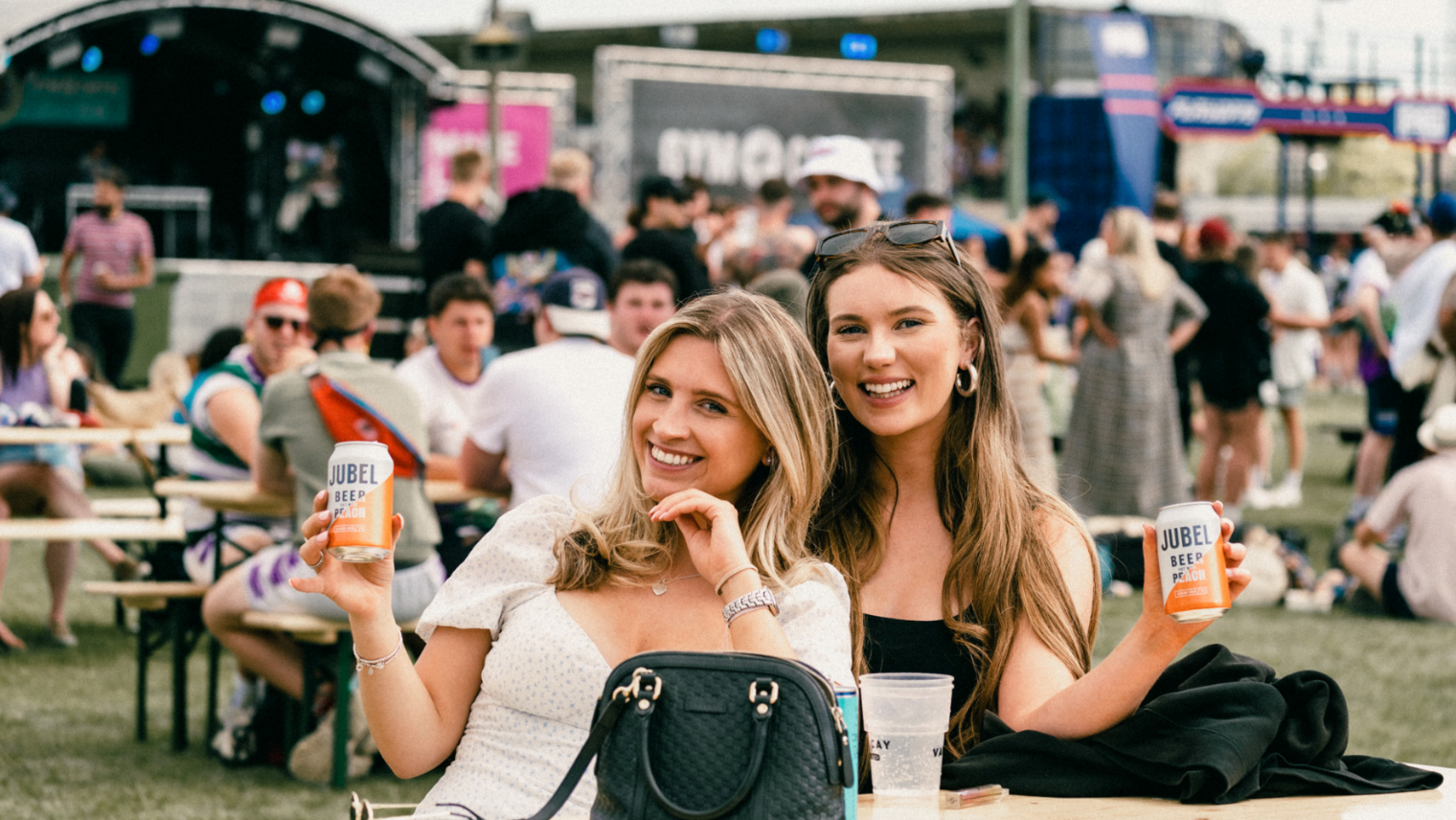 2 women with a drink in their hand at the Summer Social festival