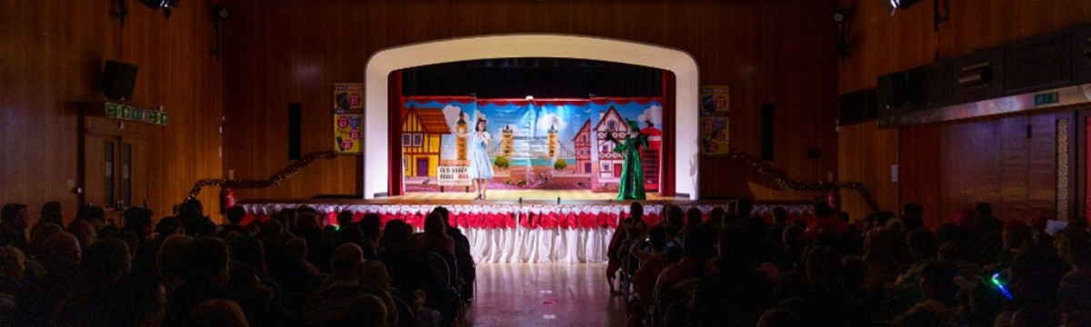 A performance on stage with an audience watching