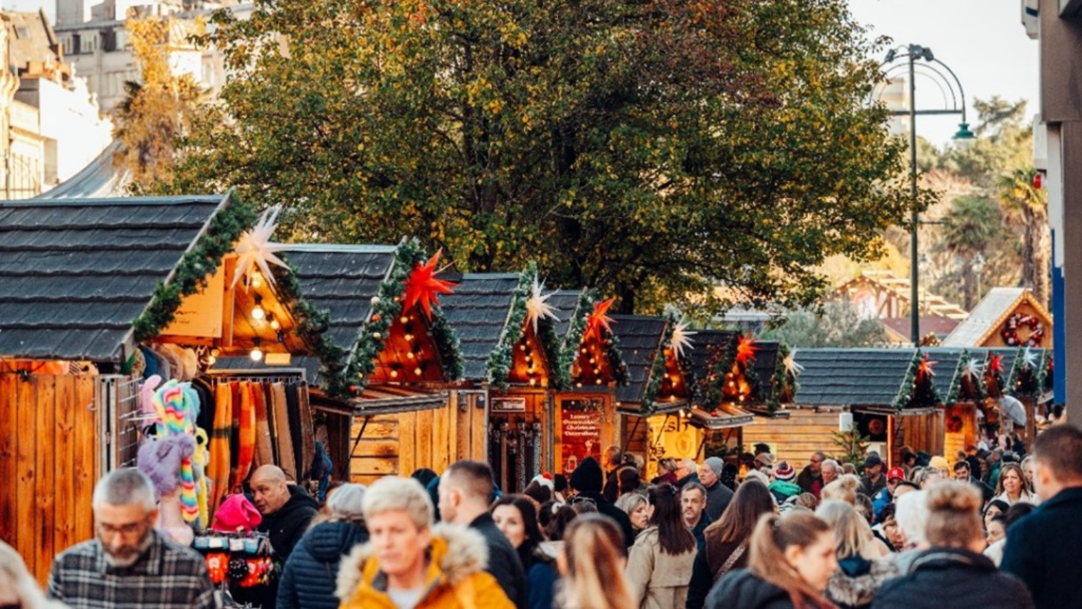 Crowds of people at Christmas market huts