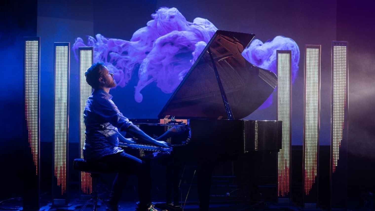 A person on stage playing the piano