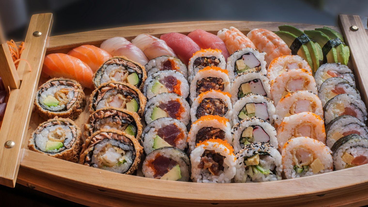 A plate filled with different types of sushi