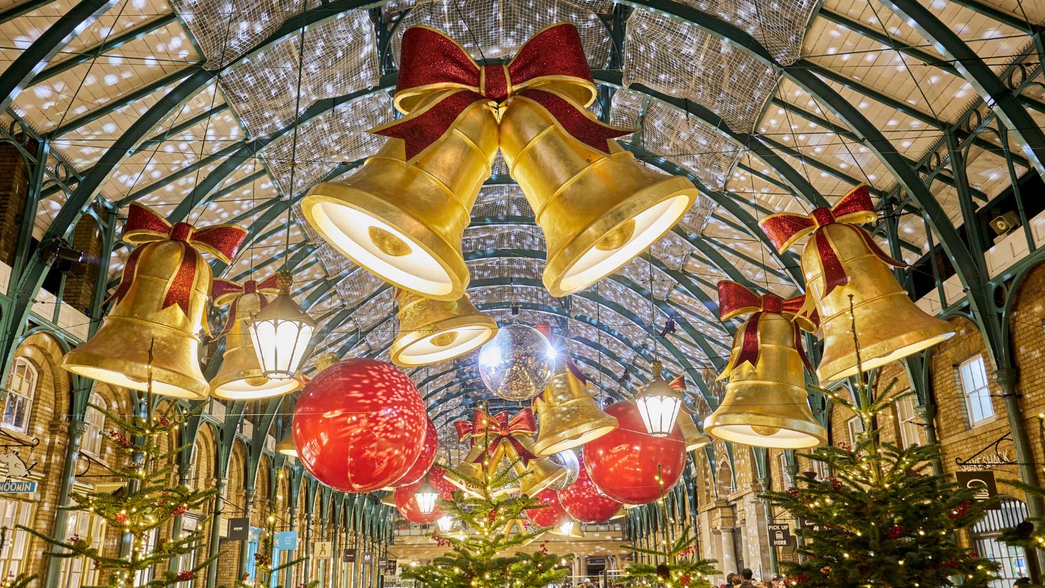 Large golden bells draped from the ceiling at Covent Garden