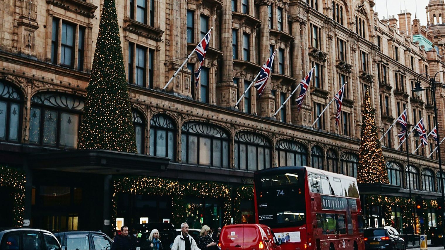 A photo of Harrods entrance with Christmas trees