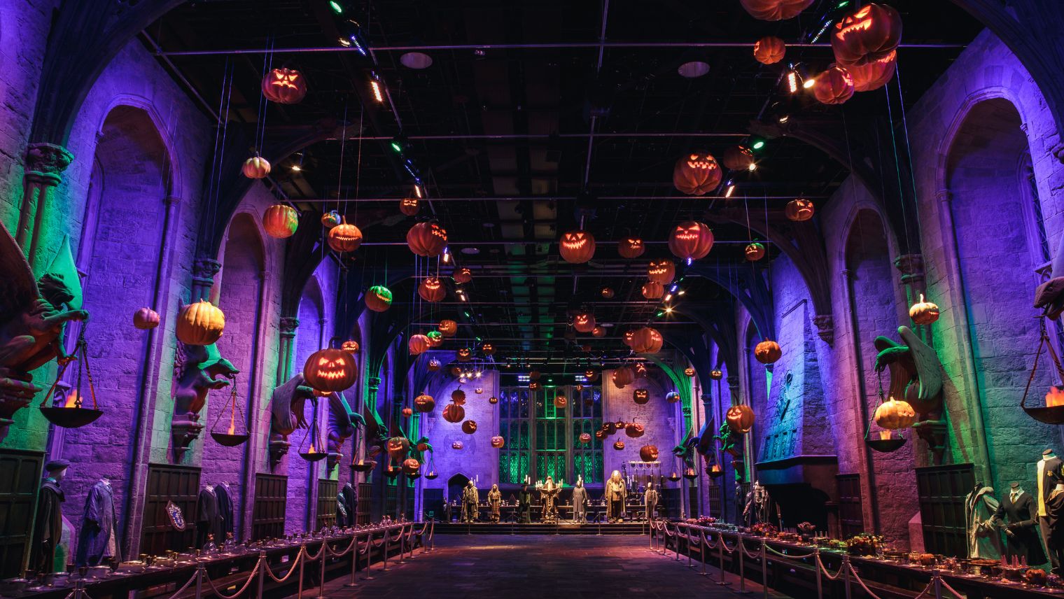 A school hall from the Harry Potter films with floating pumpkins