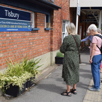 A small group of people outside Tisbury Station